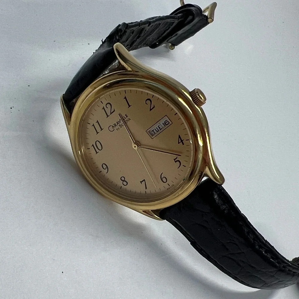 Caravelle by Bulova Vintage Quarts Watch Day Date Second Hand Function